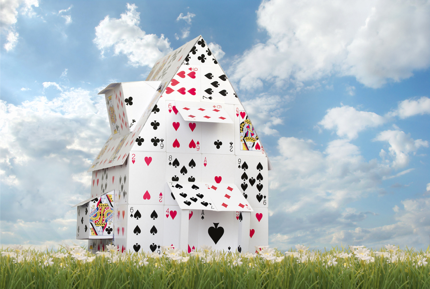 Card House Against Blue Skies